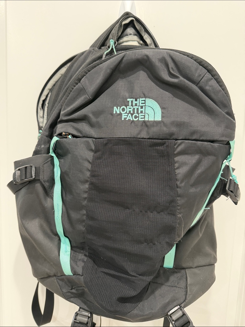 The North Face Black Backpack with Mint Green Accents